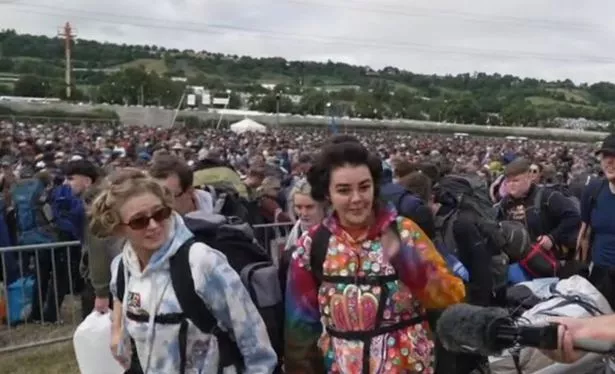 Festival goers arrive for the start of the 2025 Glastonbury Festival, June 25 2025. Photo: BBC News