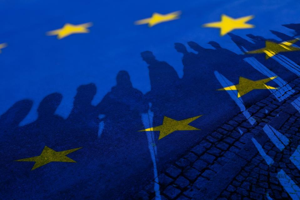 Flag of European Union with silhouette of people