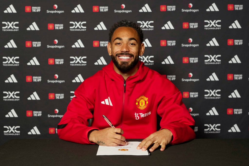 Matheus Cunha of Manchester United is signing his contract after joining from Wolves.