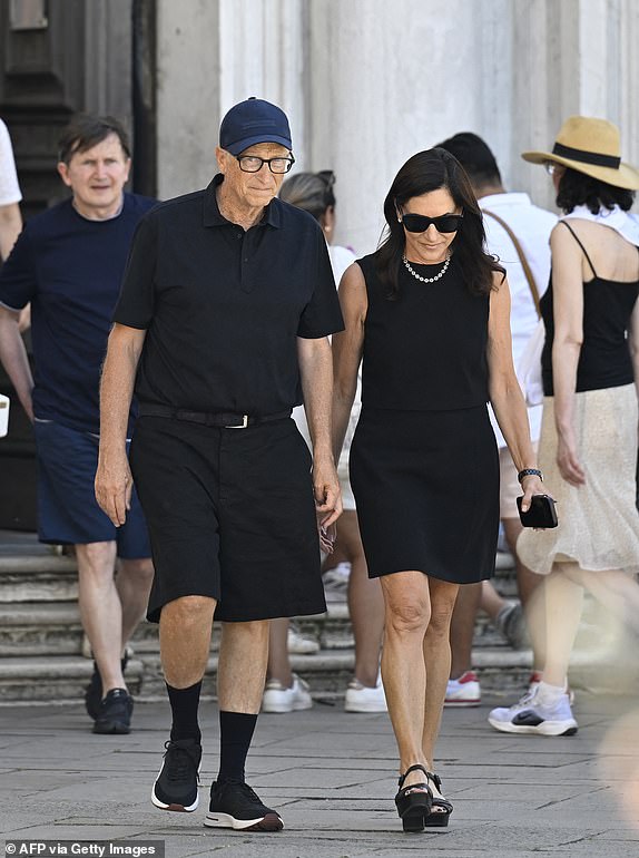 14854193 Billionaire Bill Gates goes incognito with new girlfriend as other Bezos wedding guests lap up the limelight US tech entrepreneur Bill Gates and partner Paula Hurd leave after a visit at the Gallerie dell'Accademia di Venezia, ahead of US Amazon founder Jeff Bezos' wedding with Lauren Sanchez, on June 27, 2025.  (Photo by ANDREA PATTARO / AFP) (Photo by ANDREA PATTARO/AFP via Getty Images)