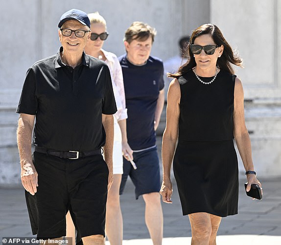 14854193 Billionaire Bill Gates goes incognito with new girlfriend as other Bezos wedding guests lap up the limelight US tech entrepreneur Bill Gates and partner Paula Hurd leave after a visit at the Gallerie dell'Accademia di Venezia, ahead of US Amazon founder Jeff Bezos' wedding with Lauren Sanchez, on June 27, 2025.  (Photo by ANDREA PATTARO / AFP) (Photo by ANDREA PATTARO/AFP via Getty Images)