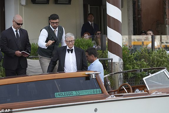 Bill Gates leaves a hotel ahead of the anticipated wedding celebrations of Jeff Bezos and Lauren Sanchez, in Venice, Italy, Friday, June 27, 2025. (AP Photo/Antonio Calanni)