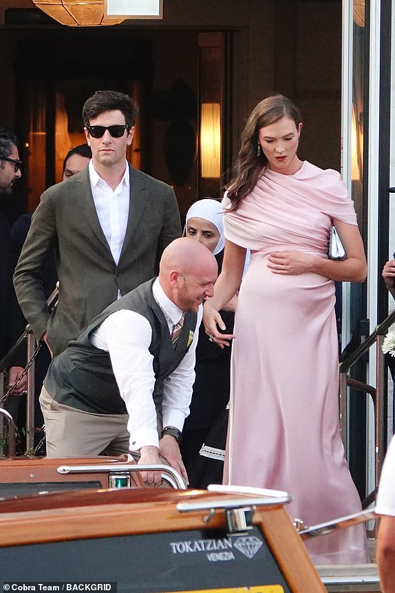 BGUK_3283379 - Venice, ITALY  Pregnant Karlie Kloss and husband Joshua Kushner were seen in Venice, enjoying the festivities at Jeff Bezos' wedding while embracing their growing family.  Pictured: Karlie Kloss and Joshua Kushner  BACKGRID UK 26 JUNE 2025   BYLINE MUST READ: COBRA TEAM / BACKGRID  UK: +44 208 344 2007 / uksales@backgrid.com  USA: +1 310 798 9111 / usasales@backgrid.com  *Pictures Containing Children Please Pixelate Face Prior To Publication*