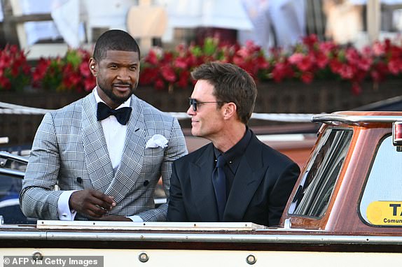 US singer Usher Raymond IVl (L) and US football player Tom Brady leave the Gritti Palace Hotel on the wedding day of Amazon founder Jeff Bezos with Lauren Sanchez, in Venice on June 27, 2025.  (Photo by Stefano Rellandini / AFP) (Photo by STEFANO RELLANDINI/AFP via Getty Images)