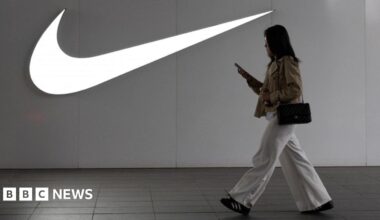 A woman walks past a Nike store in Beijing, China, 8 April 2025.