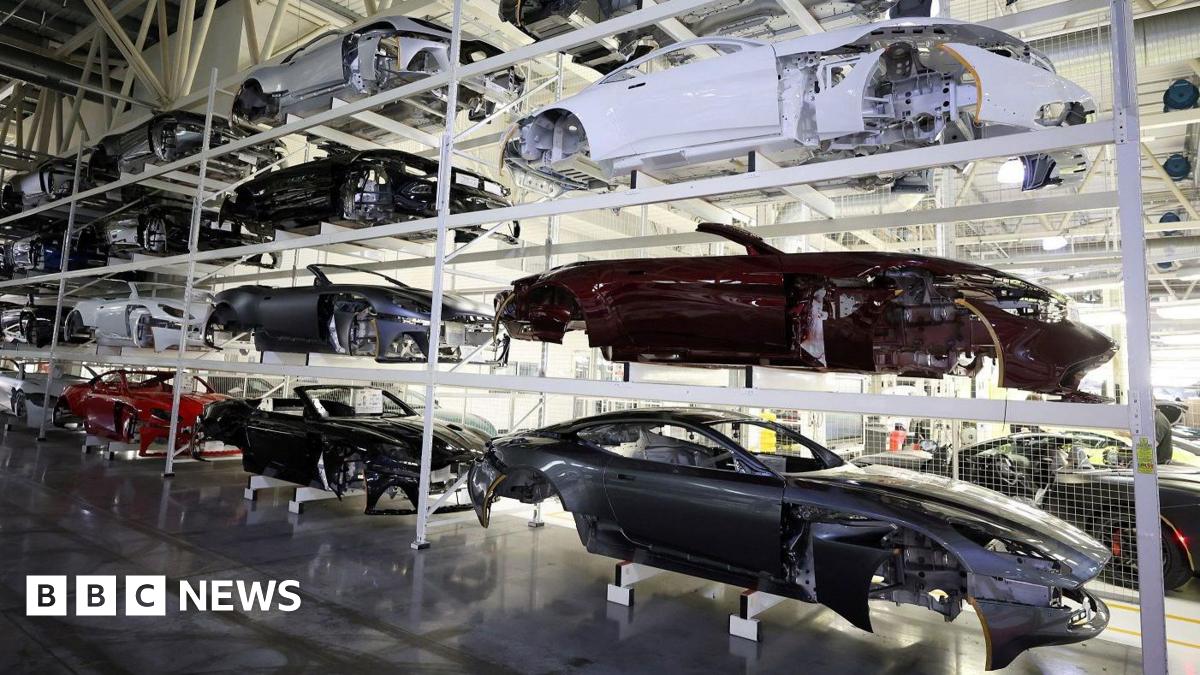 Car bodies are stored on shelves at the Aston Martin factory in Gaydon, Britain