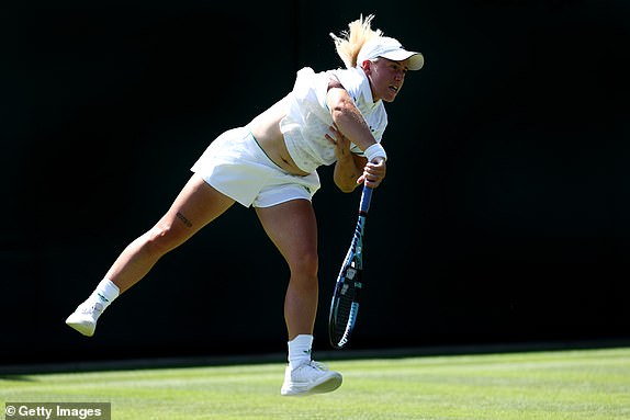 LONDON, ENGLAND - JUNE 30: Sonay Kartal of Great Britain serves against Jelena Ostapenko of Latvia during the Ladies' Singles first round match against on day one of The Championships Wimbledon 2025 at All England Lawn Tennis and Croquet Club on June 30, 2025 in London, England. (Photo by Dan Istitene/Getty Images)