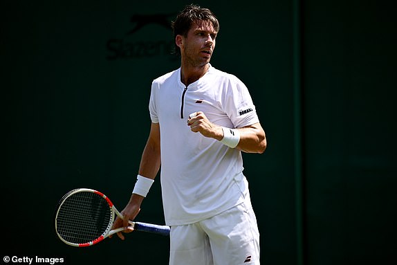 LONDON, ENGLAND - JUNE 30: Cameron Norrie of Great Britain celebrates against Roberto Bautista Agut of Spain during the Gentleman's Singles First Round match on day one of The Championships Wimbledon 2025 at All England Lawn Tennis and Croquet Club on June 30, 2025 in London, England. (Photo by Hannah Peters/Getty Images)