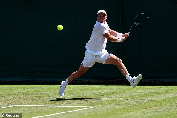 Tennis - Wimbledon - All England Lawn Tennis and Croquet Club, London, Britain - June 30, 2025 Britain's Oliver Crawford in action during his first round match against Italy's Mattia Bellucci REUTERS/Toby Melville
