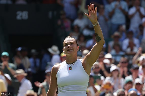epa12206307 Aryna Sabalenka of Belarus celebrates after winning the Women's 1st round match against Carson Branstine of Canada at the Wimbledon Championships, Wimbledon, Britain, 30 June 2025.  EPA/NEIL HALL  EDITORIAL USE ONLY