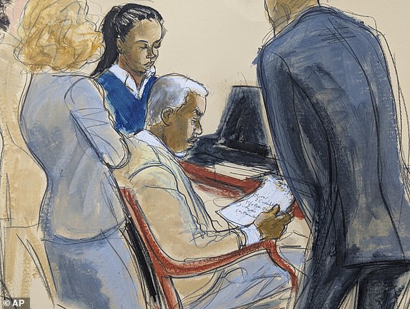 Sean ' Diddy' Combs, center, reads a jury note with his defense attorneys during jury deliberations for his sexual misconduct trial in Manhattan federal court, Monday, June 30, 2025, in New York. (Elizabeth Williams via AP)