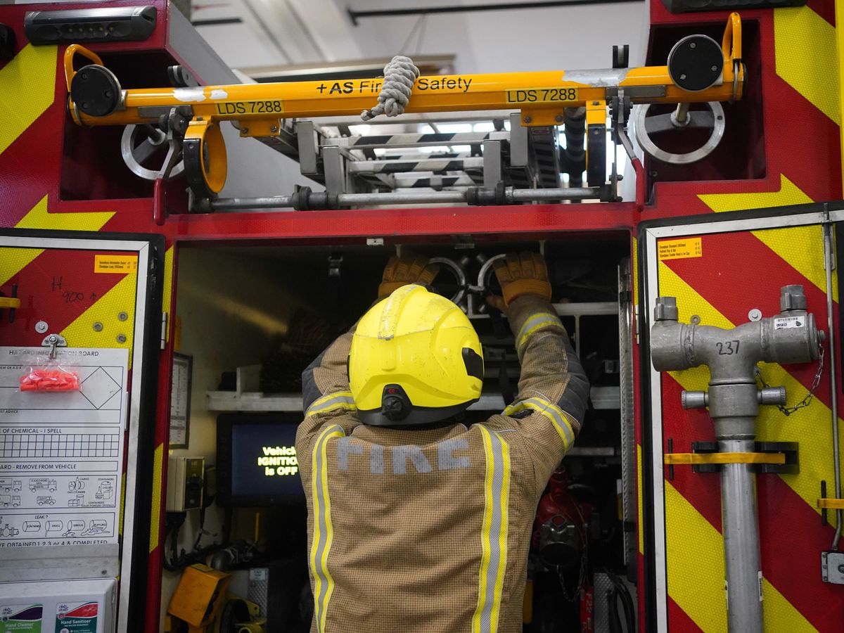 A firefighter tests equipment at London Fire Brigade