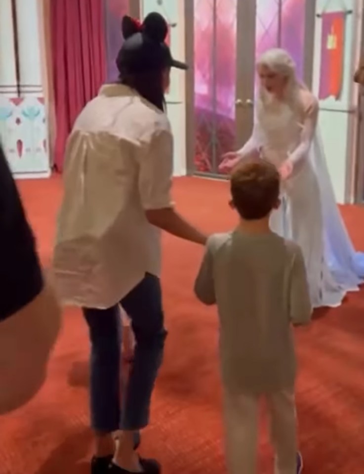 Meghan Markle and Prince Harry with their children meeting Elsa at Disneyland.