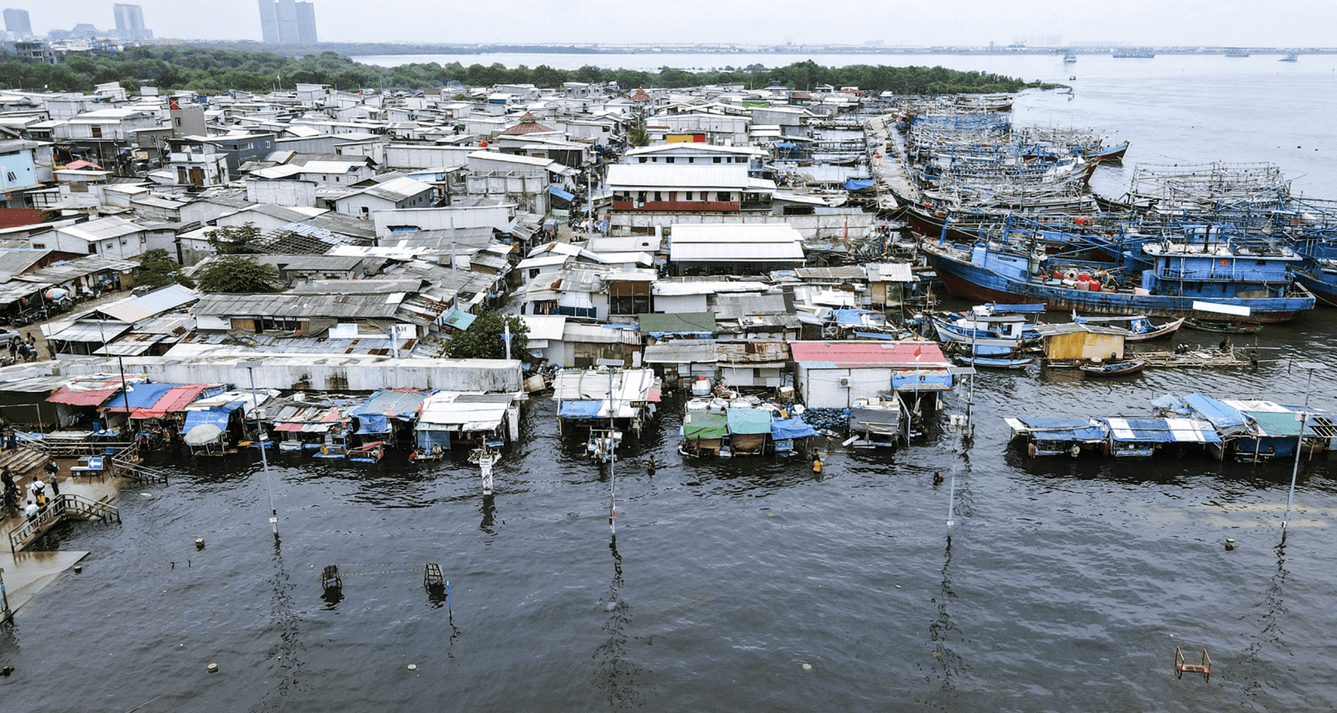 An image showing a sinking coastal area in North Jakarta, Indonesia