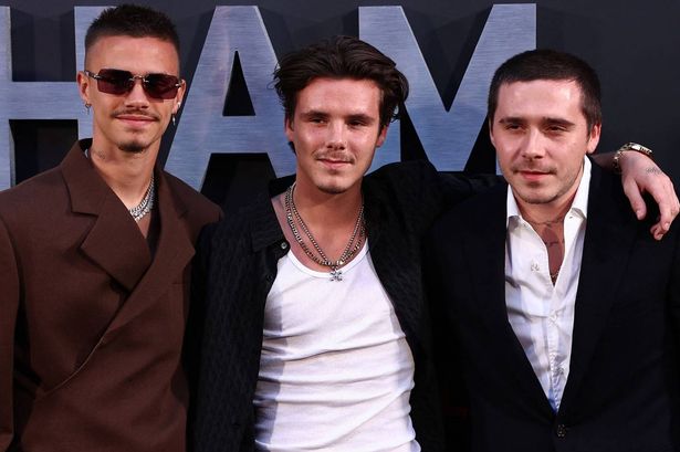 Romeo Beckham (L), Cruz Beckham (C) and their brother Brooklyn Beckham poses on the red carpet upon arrival to attend the Premiere of "Beckham" in London on October 3, 2023. (Photo by HENRY NICHOLLS / AFP) (Photo by HENRY NICHOLLS/AFP via Getty Images)