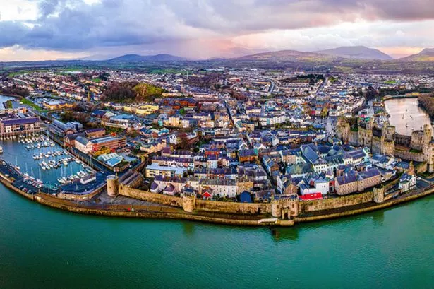 Aerial view of Caernarfon Castle, a medieval fortress in Caernarfon, Gwynedd