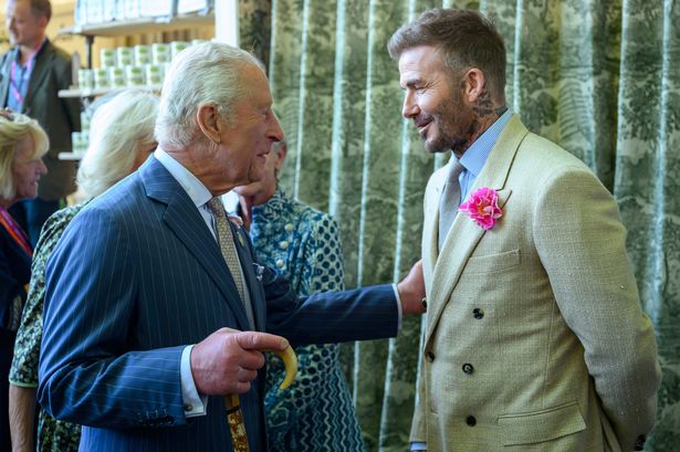 David Beckham wearing a David Austin Roses "King's Rose" speaks with King Charles III, 