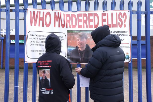A banner calling for information about Ellis Cox's murder on the loop line in Walton