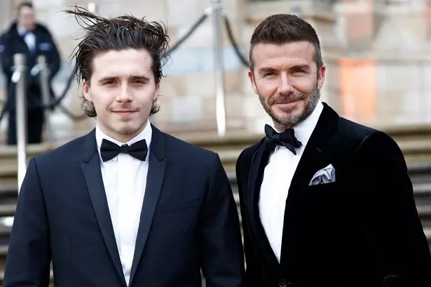 Brooklyn Beckham and his dad David Beckham