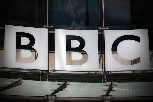 The logo for the BBC on the side of a building.