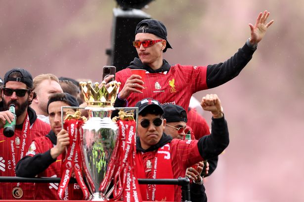 Alisson Becker, Diogo Jota, Darwin Nunez and Wataru Endo on the Liverpool team bus during the Premier League trophy parade on May 26 2025
