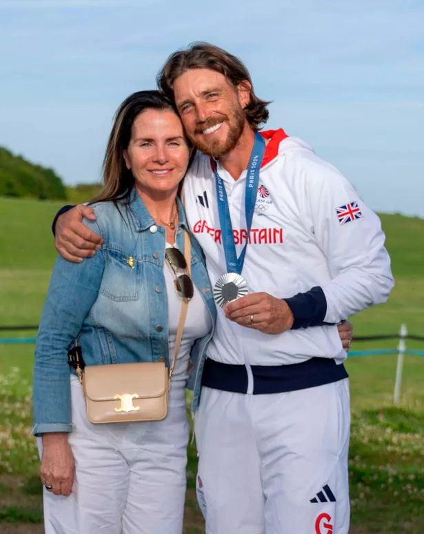 Tommy Fleetwood smiles alongside his wife Clare