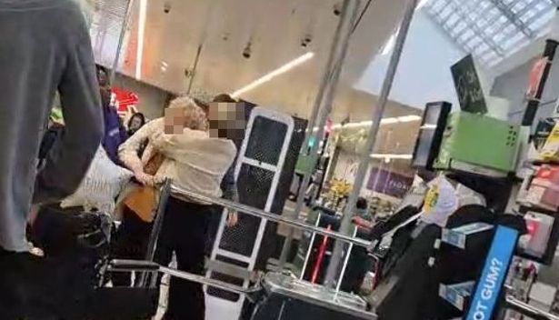 The two women then grab onto each other before falling to the floor