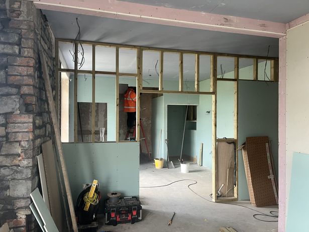 The stud walls between the two spaces plus the sauna, walk-in shower and toilet walls are added