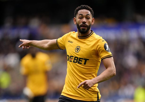 Matheus Cunha points during a game for Wolves
