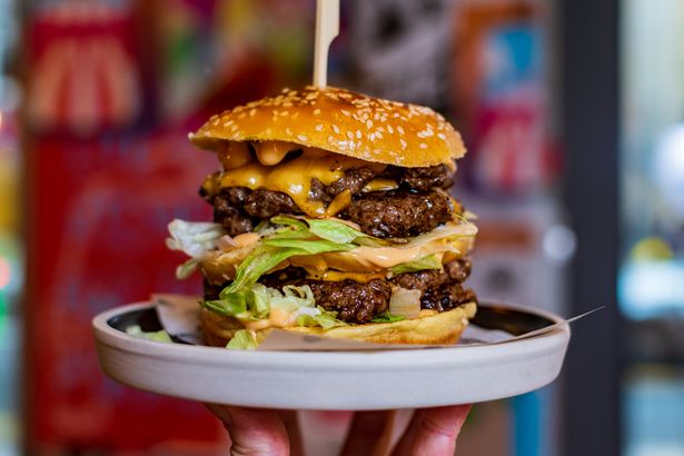 Photo shows burger on a plate