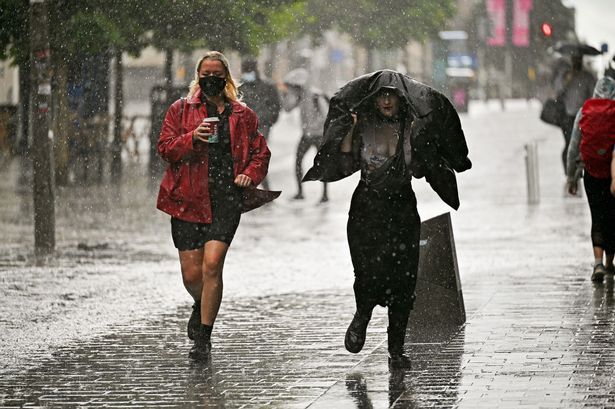 Members of the public make their way through the rain on Sauchiehall Street on August 09, 2021 in Glasgow, Scotland.
