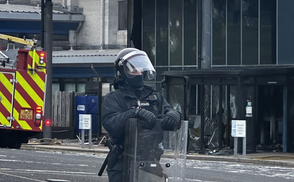 A police officer outside Larne Leisure Centre following an attack on the facility (Liam McBurney/PA)