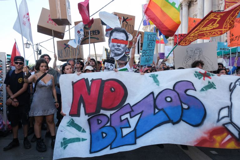 Demonstrators take part in a protest against Amazon founder Jeff Bezos, on the third day of Jeff Bezos and his wife Lauren Sanchez Bezos 