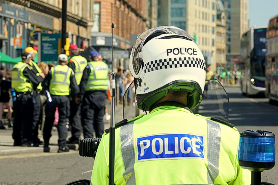 Police officer at a Celtic championship celebration in Glasgow.