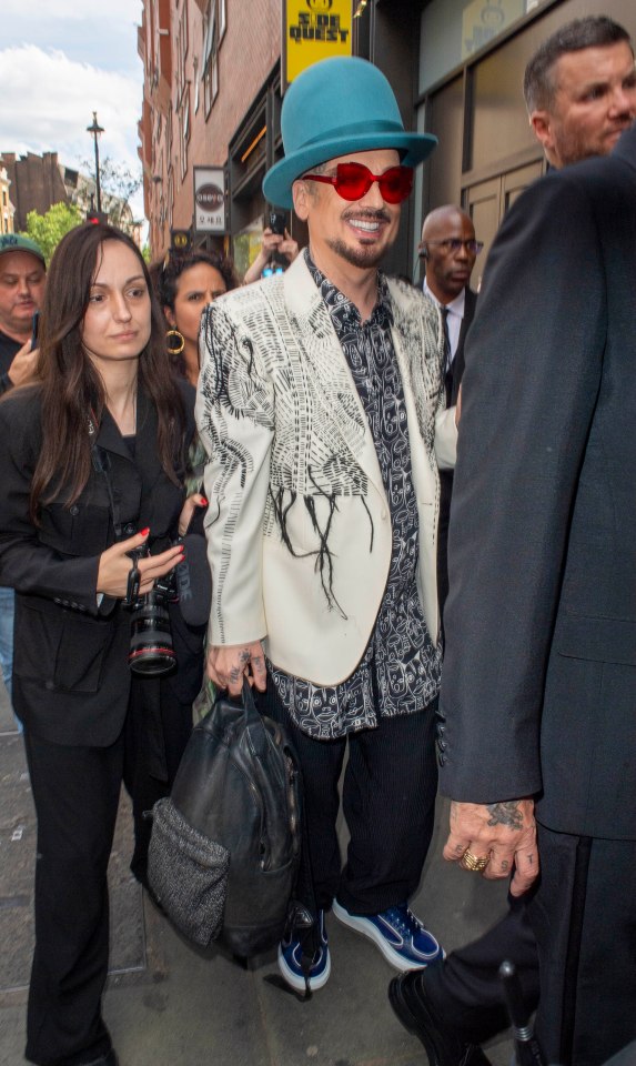DJ Fat Tony and his partner arriving at their wedding.