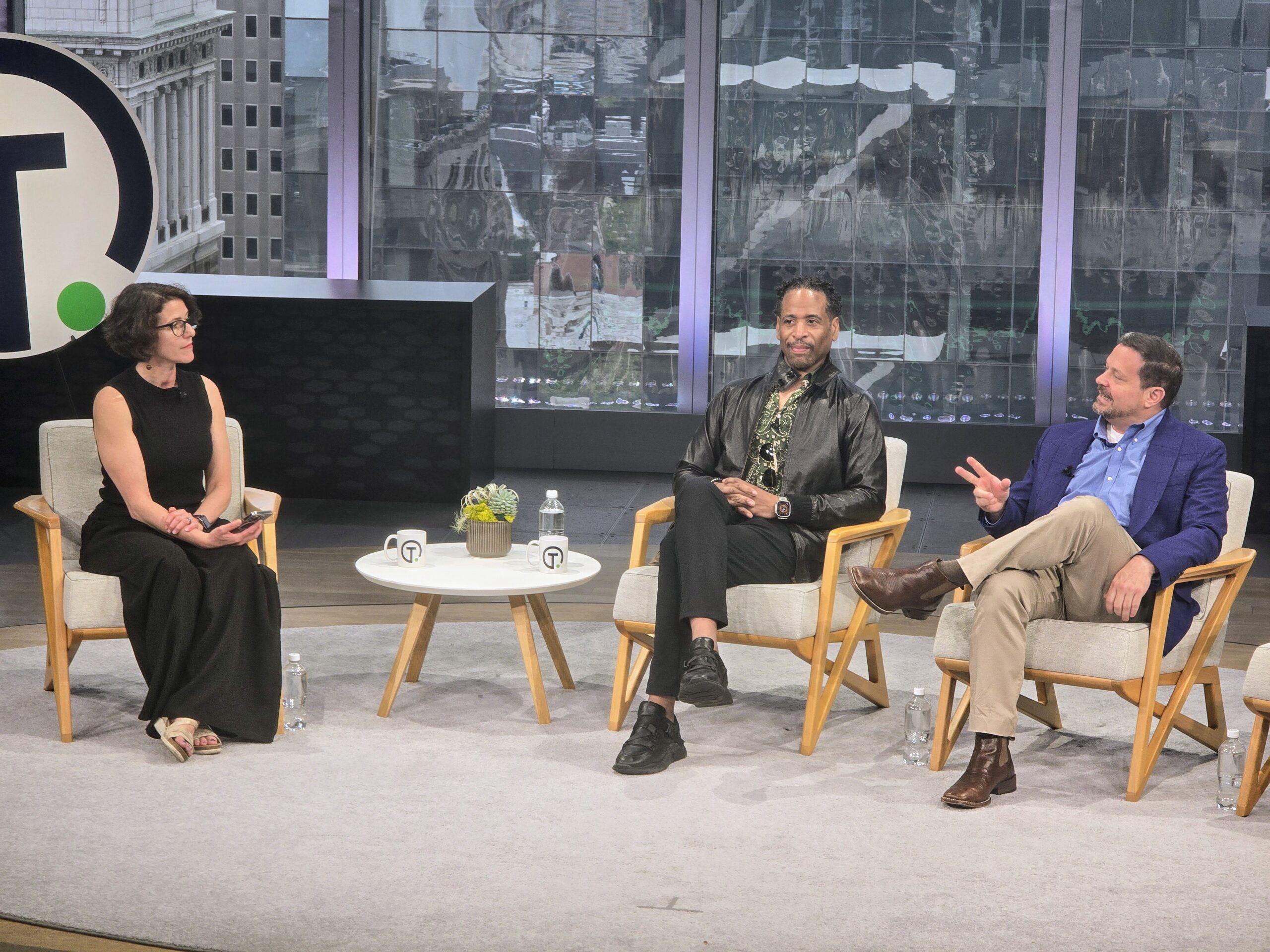 The people seated at a conference panel
