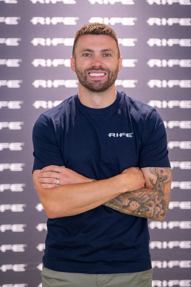 Stuart Dallas smiles as he has his picture taken