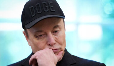 Elon Musk, bearing a black eye, listens as U.S. President Donald Trump speaks to reporters in the Oval Office of the White House.