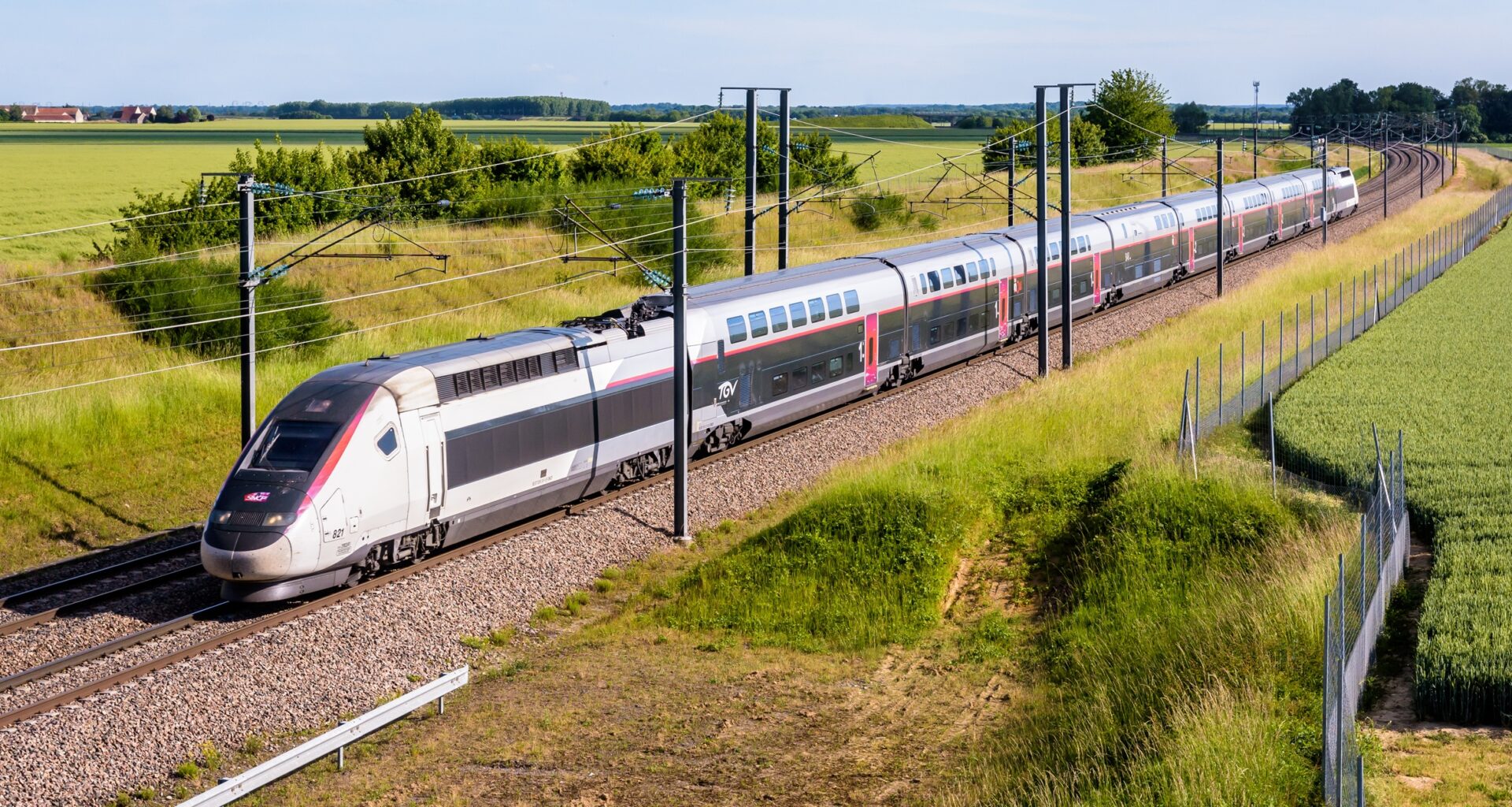 Champdeuil, France - A TGV Euroduplex inOui high speed train from french rail company SNCF is driving to Paris on the LGV Sud-Est in the countryside