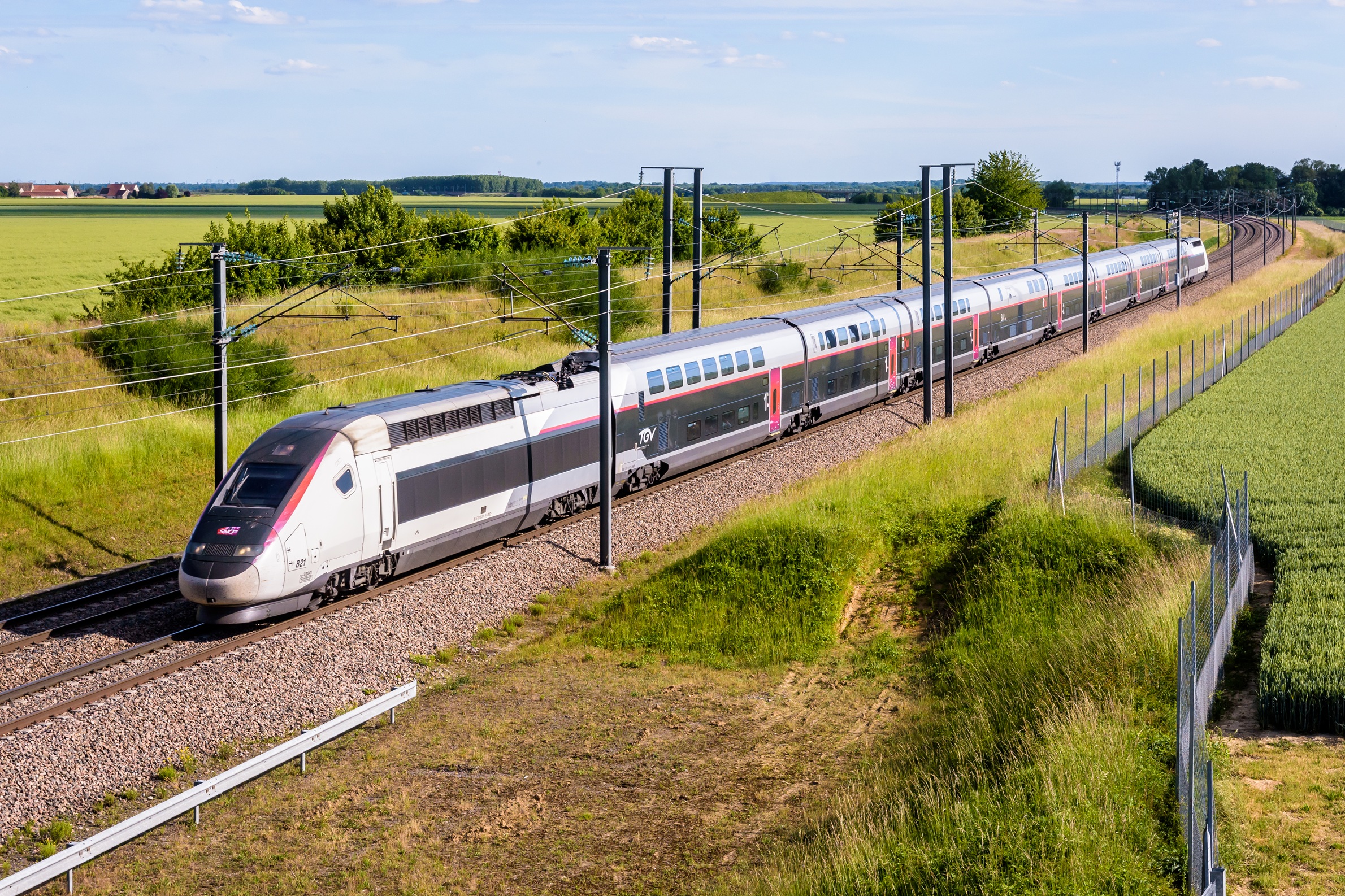 Champdeuil, France - A TGV Euroduplex inOui high speed train from french rail company SNCF is driving to Paris on the LGV Sud-Est in the countryside