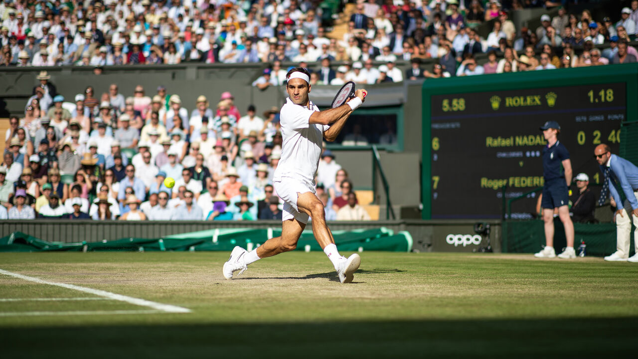 Roger Federer of Switzerland in action during the Men's Singles Semi Final against Rafael Nadal of Spain at The Wimbledon Lawn Tennis Championship at the All England Lawn and Tennis Club at Wimbledon, London, England.