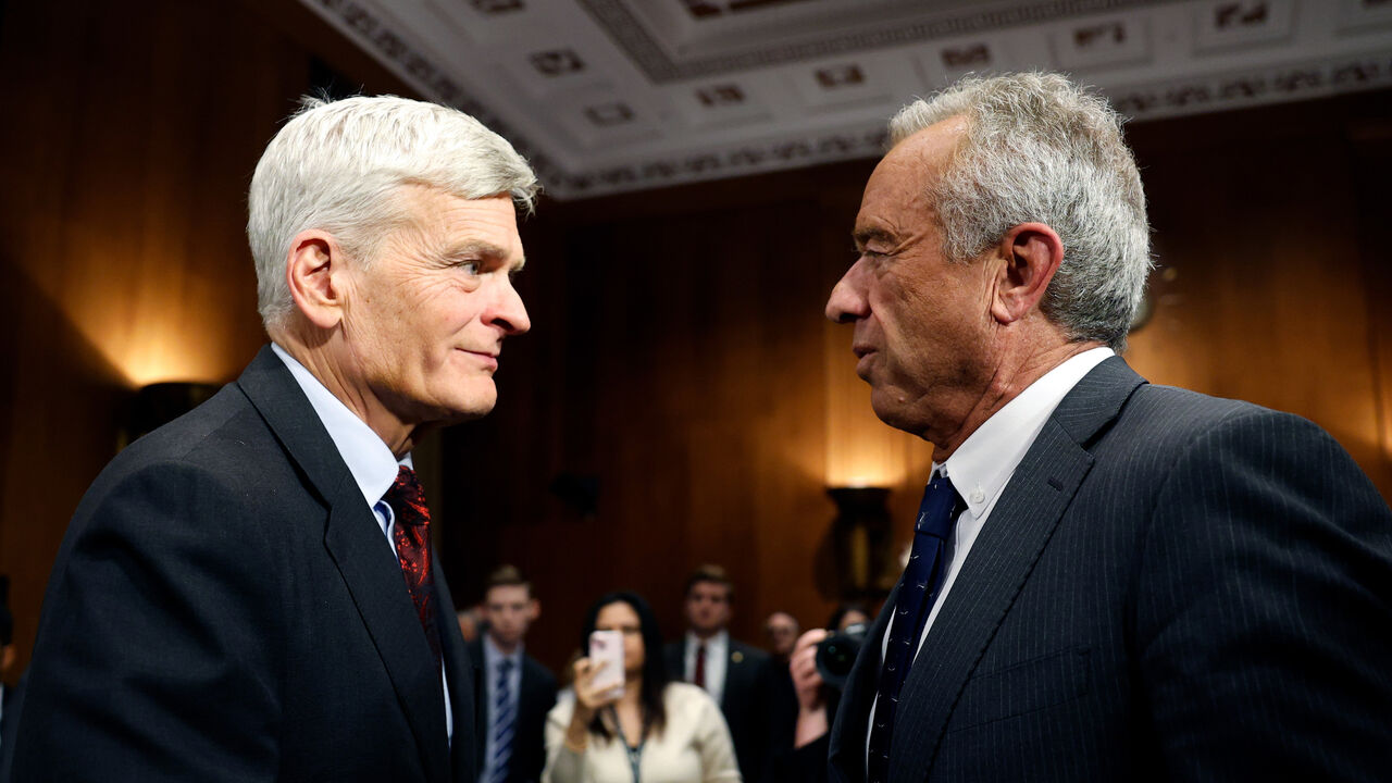 Robert F. Kennedy Jr. speaks with U.S. Sen. Bill Cassidy after testifying in his Senate Committee on Health, Education, Labor and Pensions confirmation hearing.