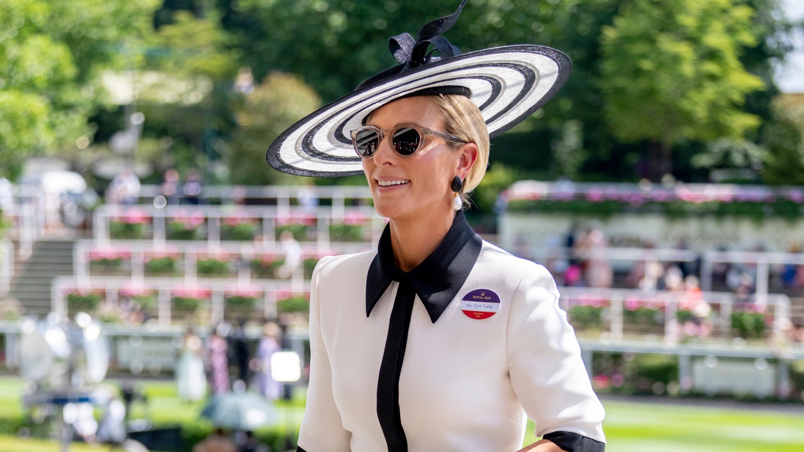 Image may contain: Zara Tindall, Person, Clothing, Footwear, High Heel, Shoe, Adult, Wristwatch, Camera, Electronics, and Hat