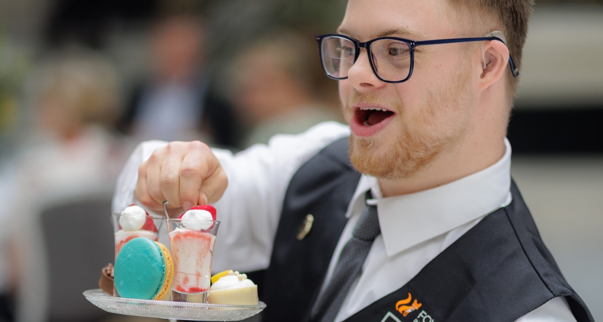 Man serves afternoon tea