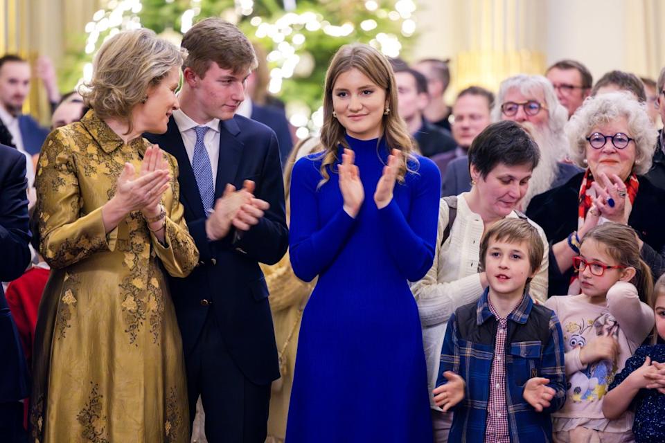 BRUSSELS, BELGIUM – DECEMBER 19: (L-R) Queen Mathilde of Belgium, Prince Emmanuel of Belgium and Princess Elisabeth of Belgium host a reception for one hundred members of the public during the festive season at the Royal Palace on December 19, 2023 in Brussels, Belgium. (Photo by Geert Vanden Wijngaert/Getty Images)