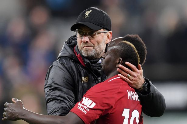 Jurgen Klopp embraces Sadio Mane after the Premier League match between Newcastle United and Liverpool at St James' Park on May 04, 2019