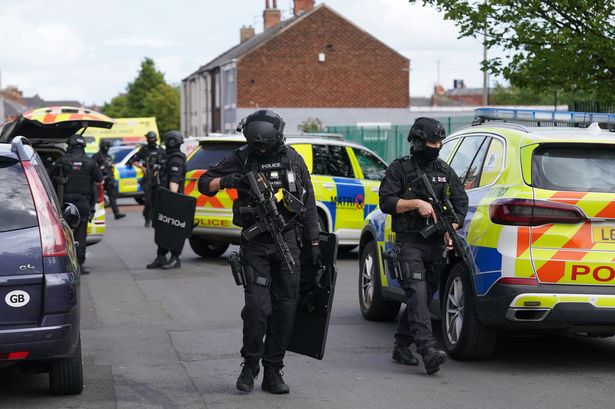 Armed police at the scene of dog attack 