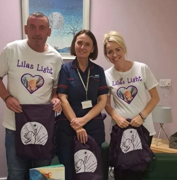 Darren and Rachael handing over 'bereavement bags' at Royal Manchester Children's Hospital as part of 'Lila's Light'  