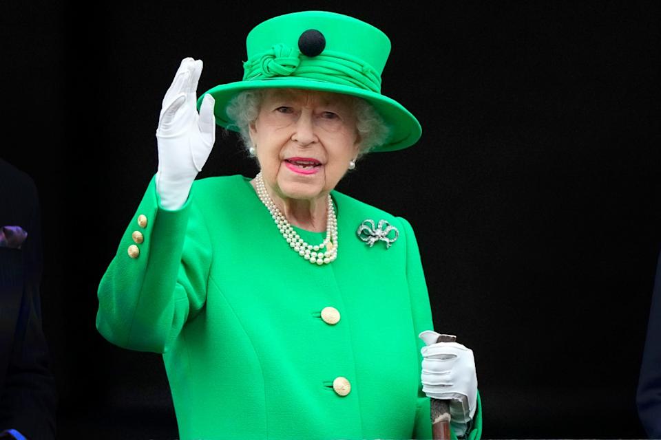 FILE – Britain’s Queen Elizabeth II waves to the crowd during the Platinum Jubilee Pageant at the Buckingham Palace in London, June 5, 2022, on the last of four days of celebrations to mark the Platinum Jubilee. Queen Elizabeth II’s death in September 2022 was arguably the most high-profile death this year. In her 70 years on the British throne, she helped modernize the monarchy across decades of enormous social change, royal marriages and births, and family scandals. For most Britons, she was the only monarch they had ever known. (AP Photo/Frank Augstein, Pool)