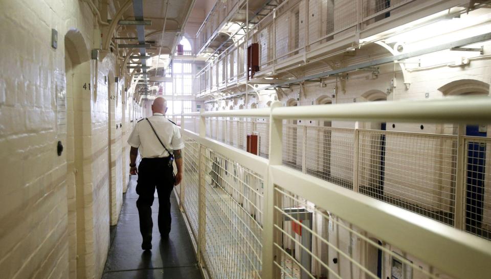 A prison guard walks down a corridor in HMP Barlinnie.